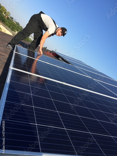 solar panel installation on the roof. Man guy install solar panels