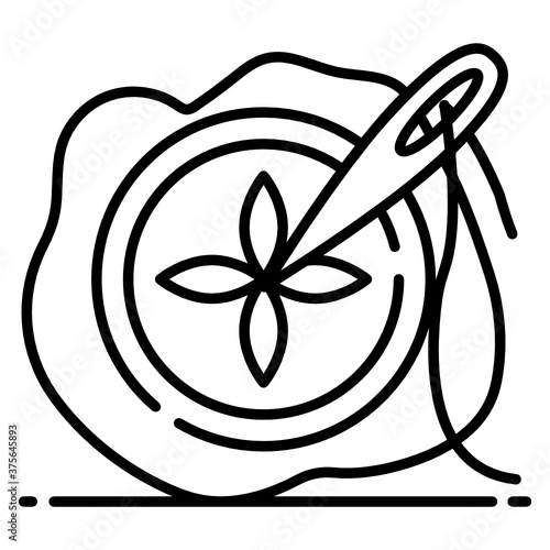 
Needle with thread on a piece of cloth, icon of needle work
