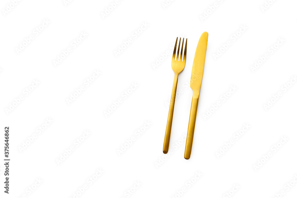 Top view with golden cutlery isolated on white background Top view with golden cutlery isolated on white background