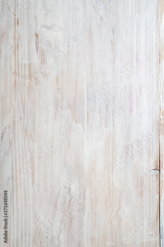 wooden background with texture painted with white paint.