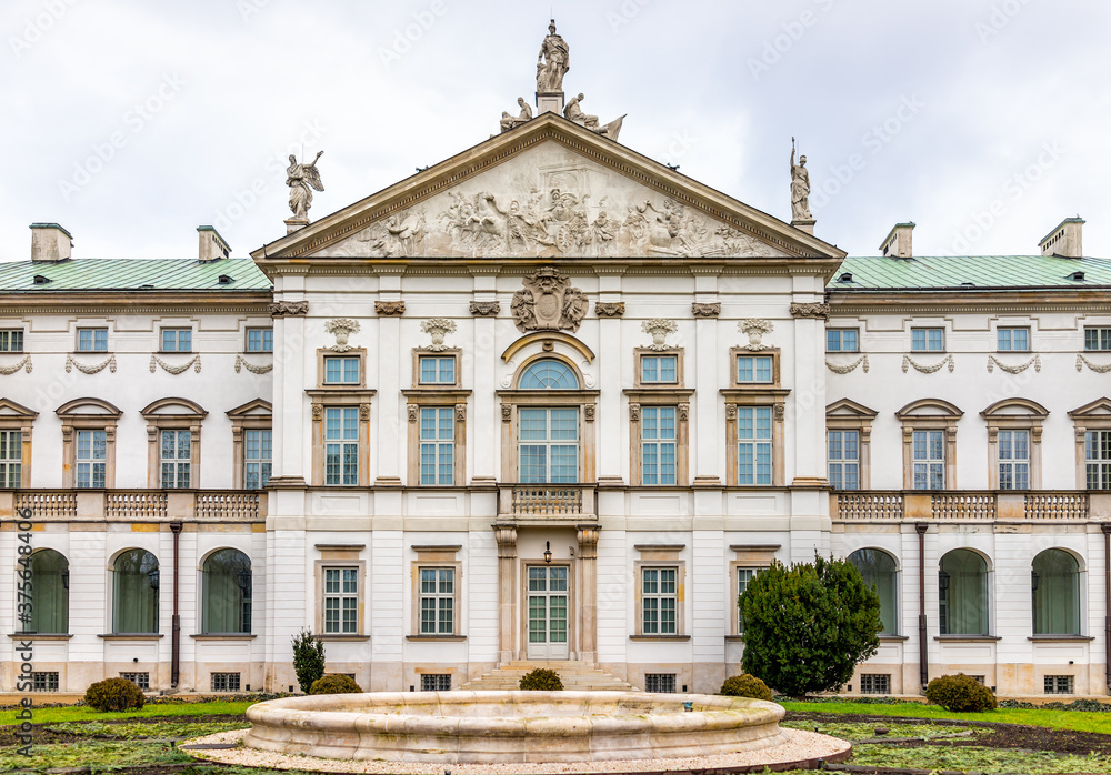Warsaw, Poland Krasinski palace with park garden in winter of Warszawa cloudy day exterior facade architecture view and stone water fountain nobody