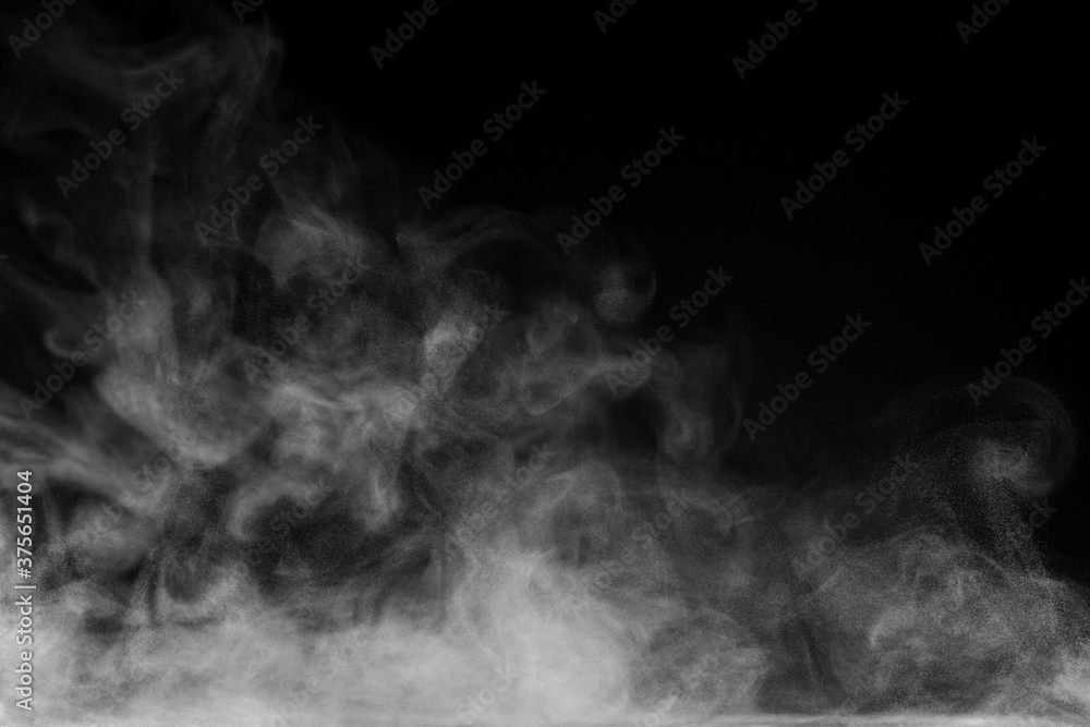 Blur white water vapour on isolated black background. Abstract of steam  with copy space. Steam flow. Smoke on white background. Stock Photo