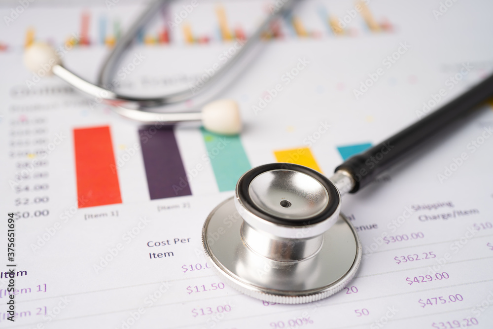Stethoscope on chart graph paper, finance, account, statistic, analytic economy Business concept. Stethoscope on chart graph paper, finance, account, statistic, analytic economy Business concept.