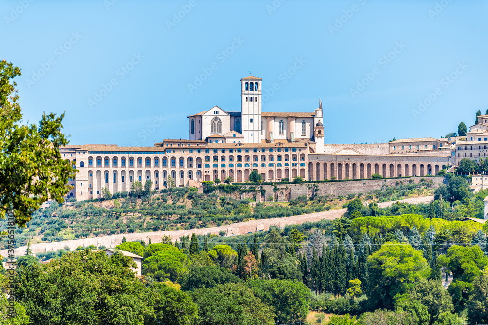 Village city town of Assisi in Umbria, Italy cityscape of famous church during summer day landscape in Etruscan countryside