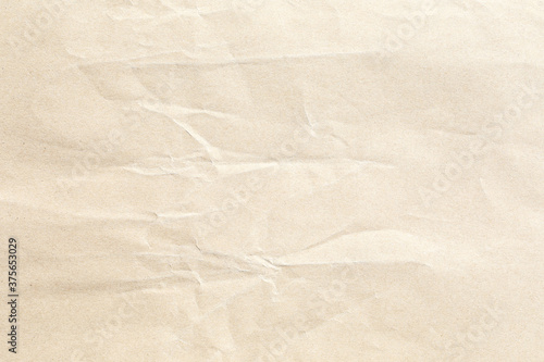 Crunpled beige brown background paper texture