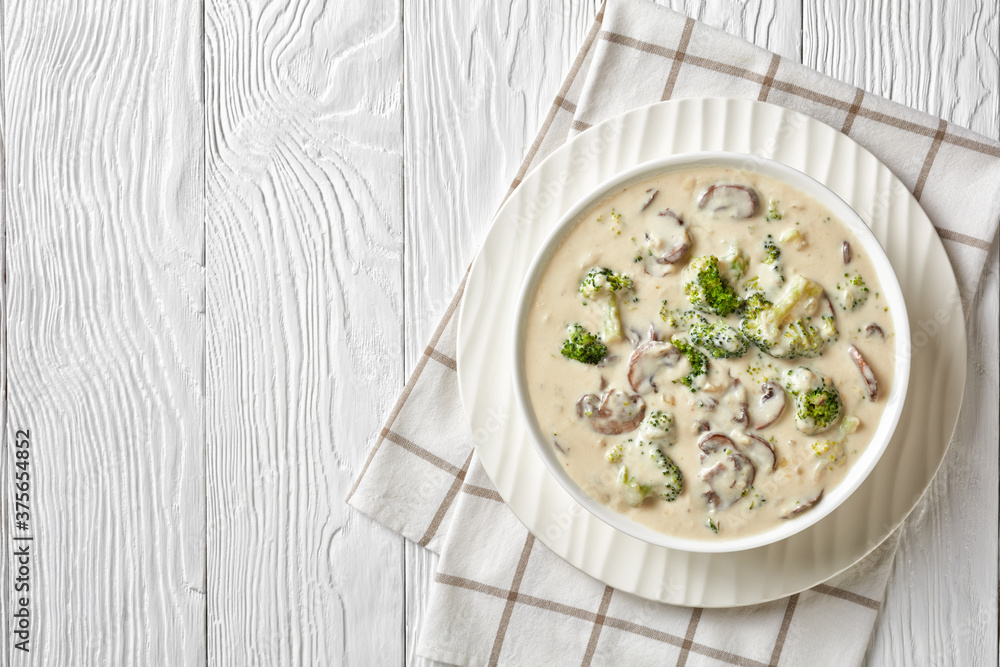 Mushroom Broccoli Cheese Soup in a white bowl Mushroom Broccoli Cheese Soup in a white bowl