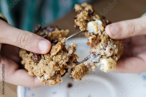Child eating gooey cookie