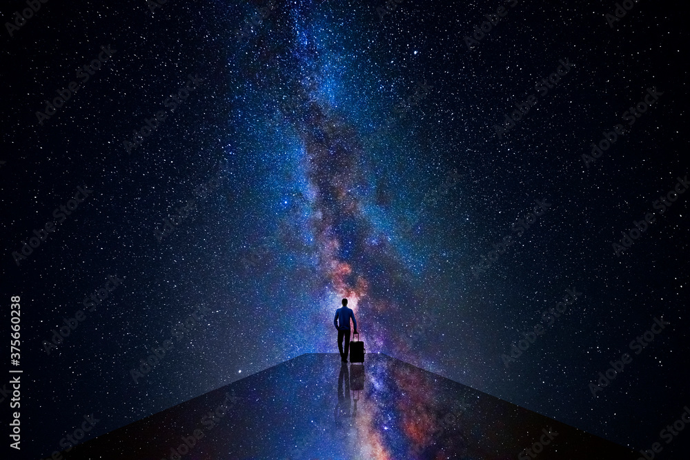 Man walking through the universe - obrazy, fototapety, plakaty 