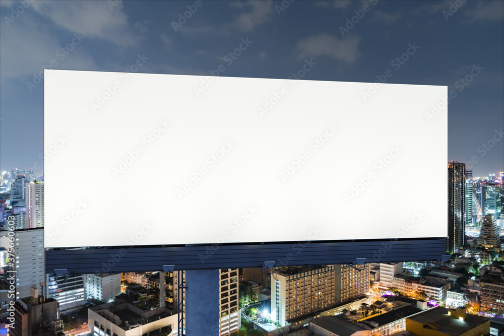 Blank white road billboard with Bangkok cityscape background at night time. Street advertising poster, mock up, 3D rendering. Front view. The concept of marketing communication to promote idea. Blank white road billboard with Bangkok cityscape background at night time. Street advertising poster, mock up, 3D rendering. Front view. The concept of marketing communication to promote idea.