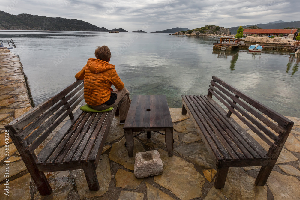 Watching the idyllic scenery on the Mediterranean, in Kekova, Turkey Watching the idyllic scenery on the Mediterranean, in Kekova, Turkey