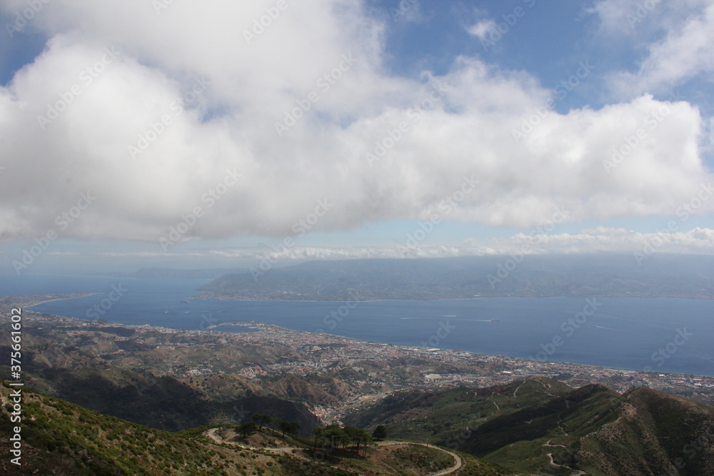  Clouds above the city, great view on the detroit of Messina