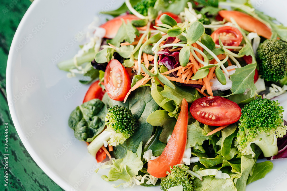 Vegan salad with water cress and broccoli Vegan salad with water cress and broccoli
