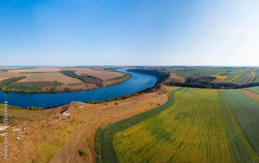 Aerial view of the canyon with a large deep river. Sown fields along the banks. Reservoir concept, water resource, ecology. Landscape. Dniester, Nagoryany, nature of Ukraine