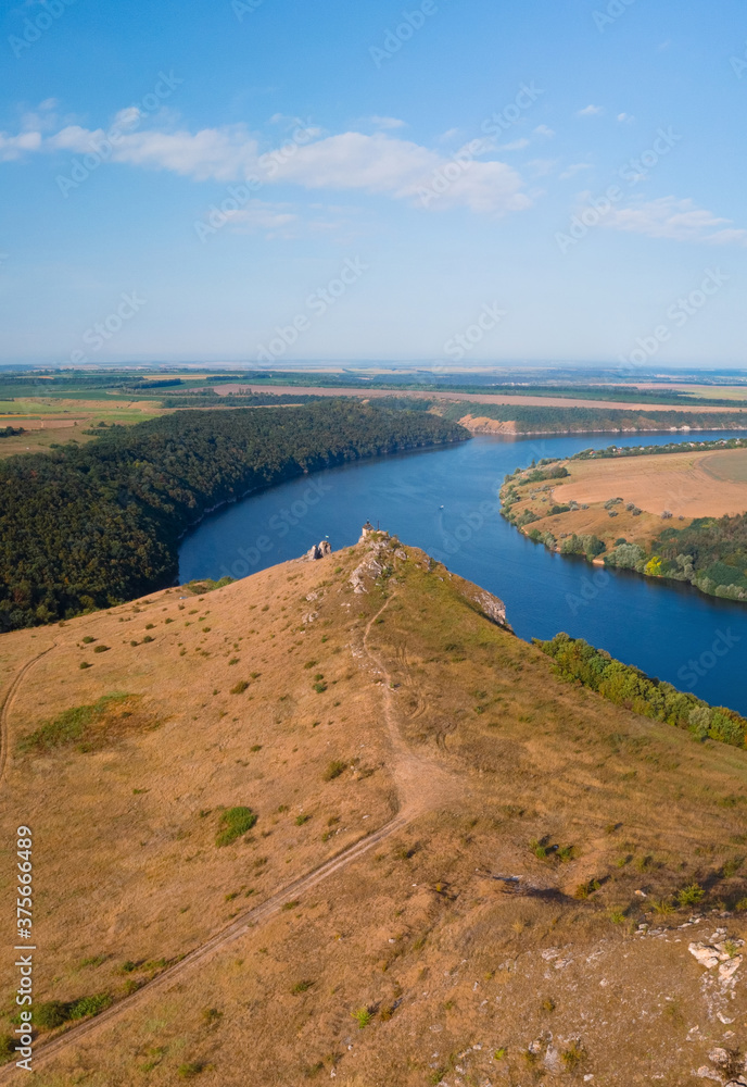 Aerial view of the canyon with a large deep river. Sown fields along the banks. Reservoir concept, water resource, ecology. Landscape. Dniester, Nagoryany, nature of Ukraine