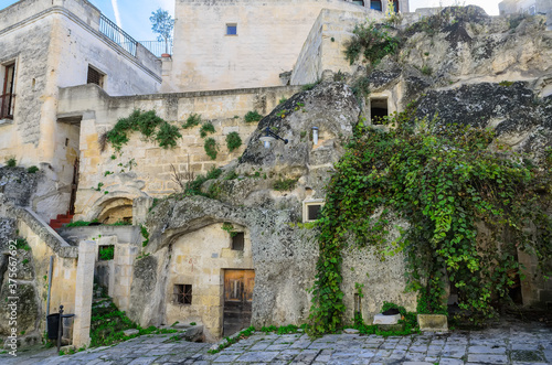 Fototapeta Naklejka Na Ścianę i Meble -  Typical architecture, streets and houses of old Matera. Most of the houses are caves hollowed out in the rocks.Matera was declared Italian host of European Capital of Culture for 2019