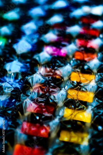 abstract multicolored background created with a colorful image through a sheet of plastic bubble wrap