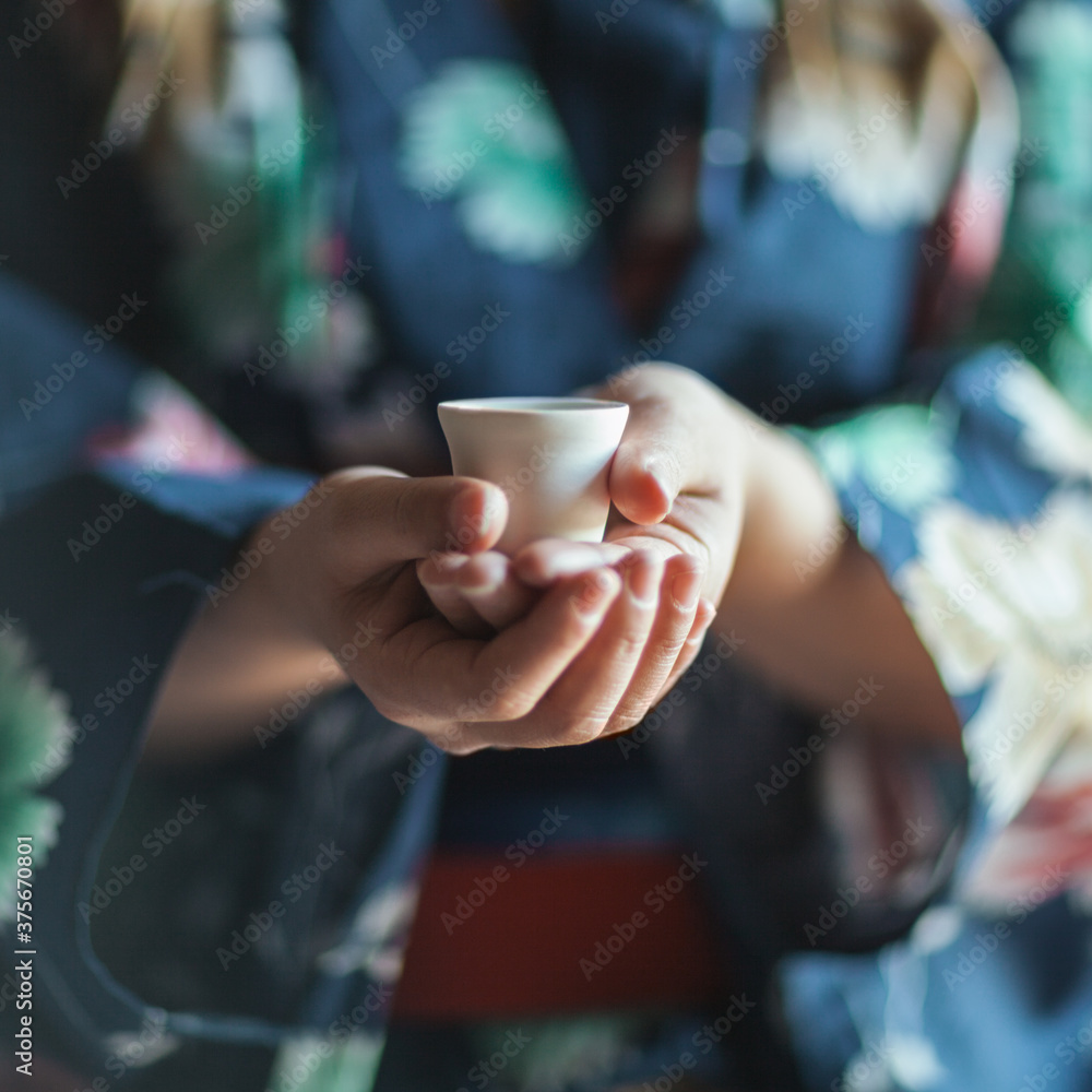 Woman Holding a Tiny Teacup Woman Holding a Tiny Teacup