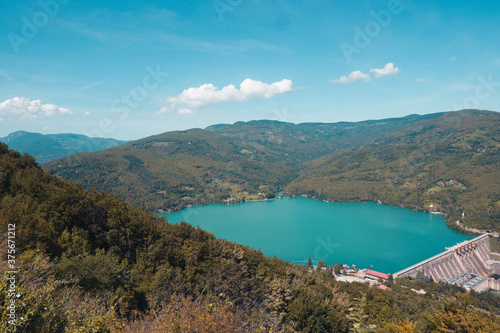 Top view of river Drina and artificial Lake Perucac  between towns of Vi  egrad in Bosnia and Hercegovina and Bajina Ba  ta in Serbia.A calm lake on a sunny summers day