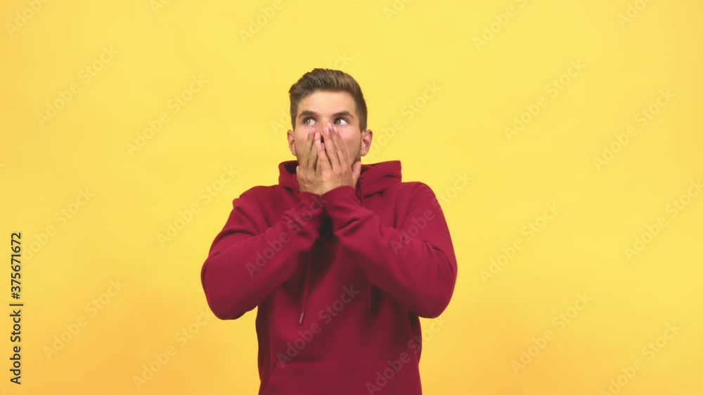Young caucasian handsome man surprised and shocked, looking with wide eyes, excited by an offer or by a new job Young caucasian handsome man surprised and shocked, looking with wide eyes, excited by an offer or by a new job