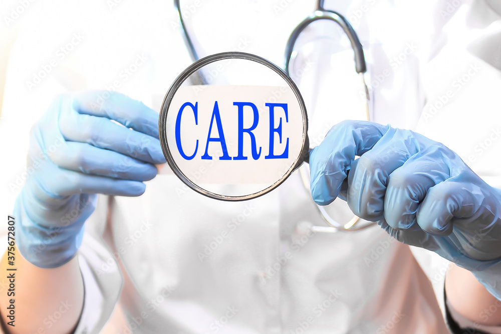 The doctor holds a card with the inscription, medical concept The doctor holds a card with the inscription, medical concept