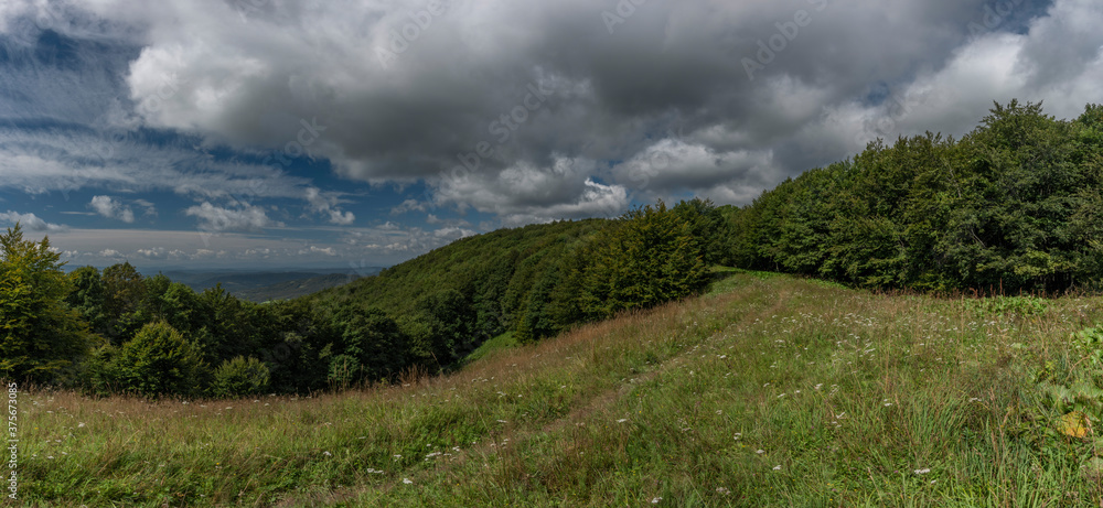 View from ridge of Poloniny national park in summer cloudy blue sky day View from ridge of Poloniny national park in summer cloudy blue sky day