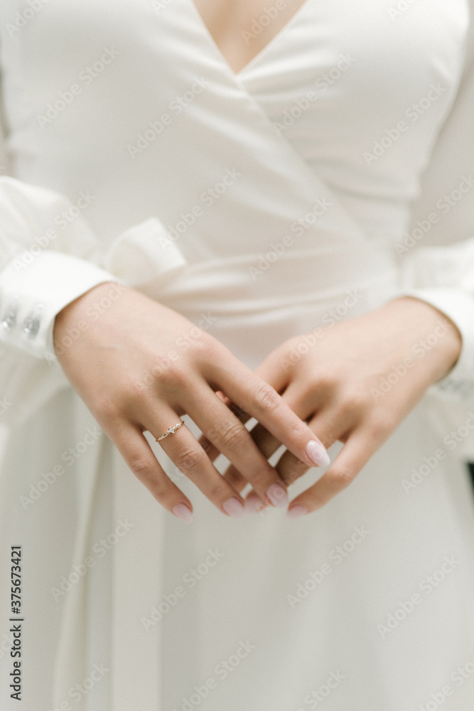 bride's hands with a ring on her finger bride's hands with a ring on her finger