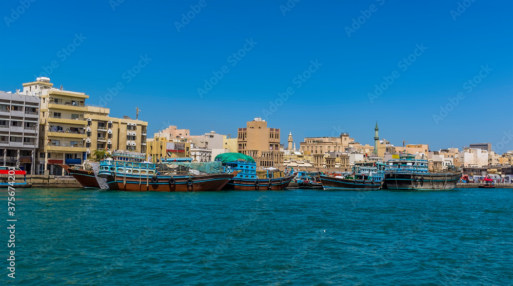 A view of Dhow cargo ships moored in the Dubai Creek in the UAE in springtime
