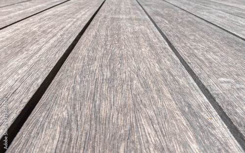 natural wood dock planks converging perspective lines closeup