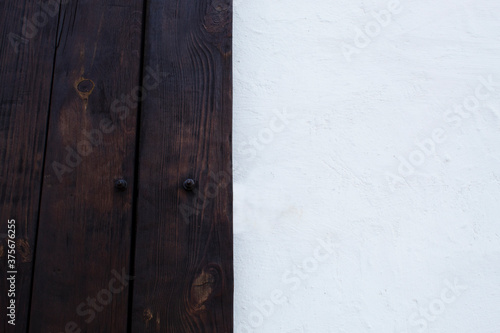 old wooden door and white wall