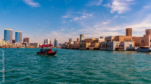 Canvas Print A view up the Dubai Creek towards the restored buildings of old Dubai in the UAE