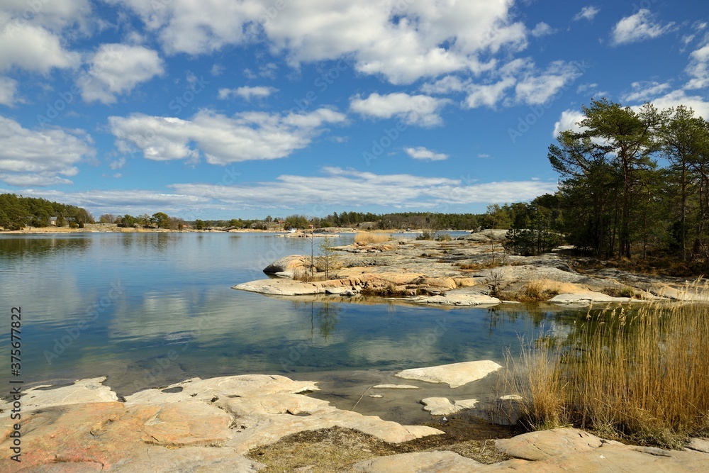 Stendorren in the Swedish archipelago. Calm water with clouds.