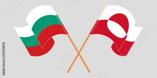 Crossed and waving flags of Greenland and Bulgaria