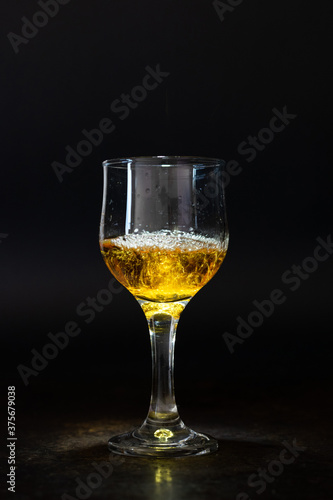 Isolated alcoholic drink, aged cognac and cigar pipe