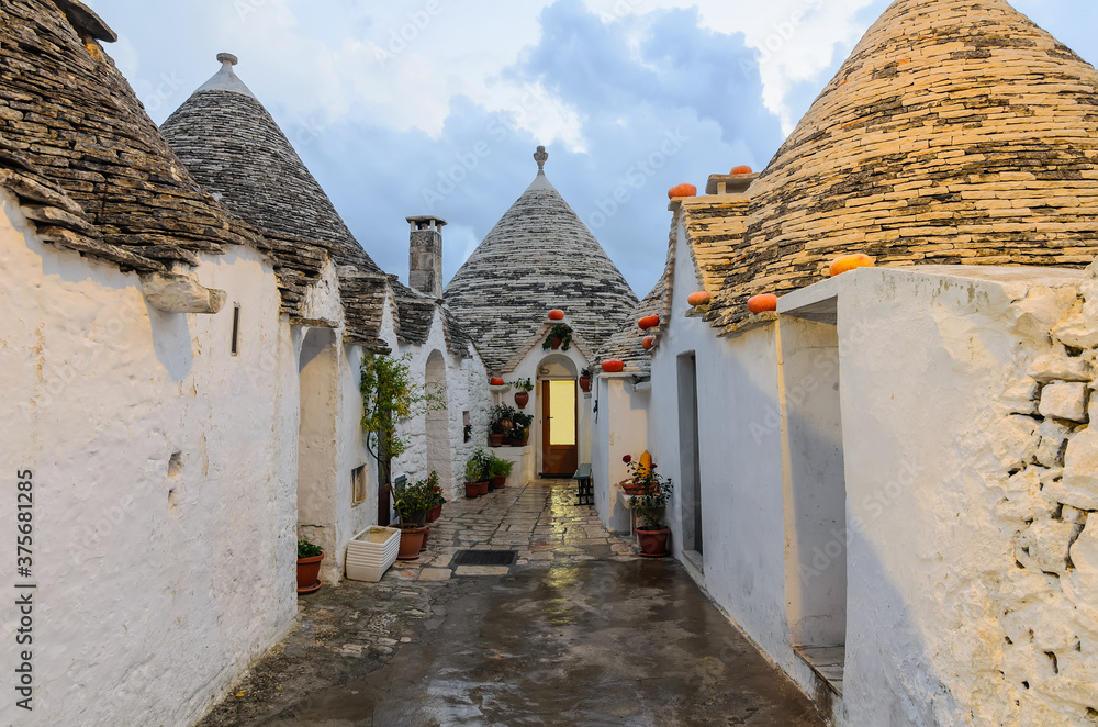 The Trullo. A trullo is a dry stone hut with a conical roof. Each trullo is decorated with pinnacle and symbol. Symbols are divided into 3 categories primitive, christian and magical.