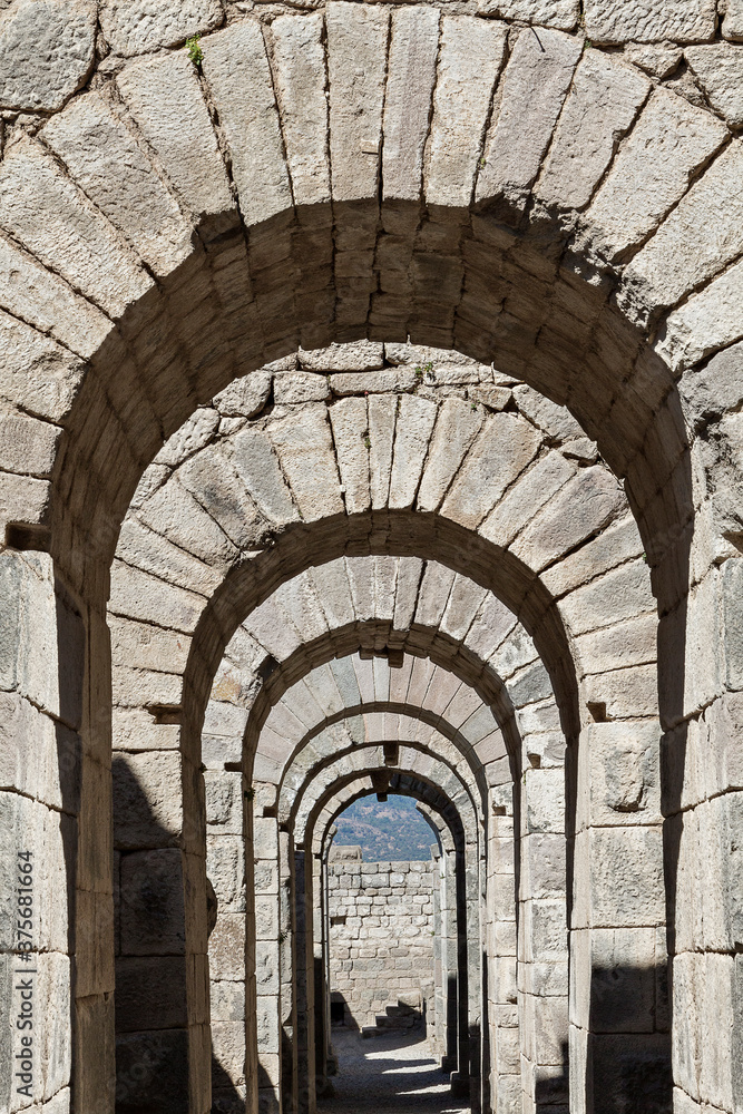 Roman vaulted substructures and archways in the ruins of the ancient city of Pergamum known also as Pergamon, Turkey
