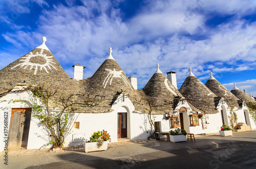 Conical roofs of trulli in Alberobello.. Each trullo is decorated with pinnacle and symbol . Symbols are divided into 3 categories primitive, christian and magical.