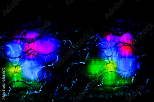 abstract background created with a colorful image through a sheet of plastic bubble wrap