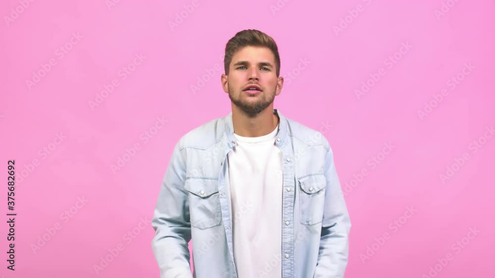 Young caucasian handsome man shouting happy, surprised by an offer or a promotion Young caucasian handsome man shouting happy, surprised by an offer or a promotion