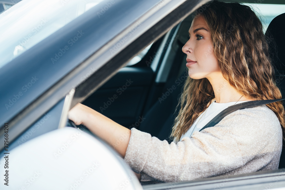 Young woman driving car stock photo