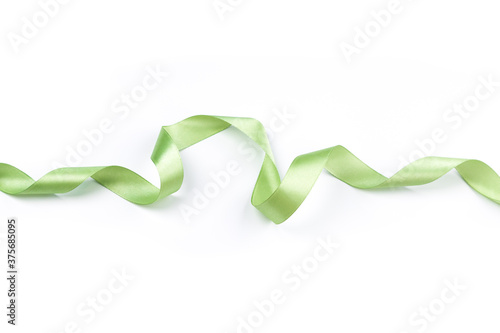 beautiful green satin ribbon with curls isolated on white 