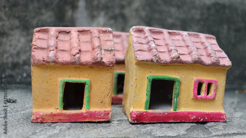 A clay toys made for kids Village Hut with a door and a window