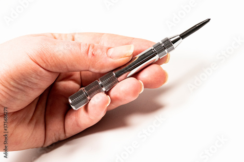 new awl with silver handle cut out on the hand