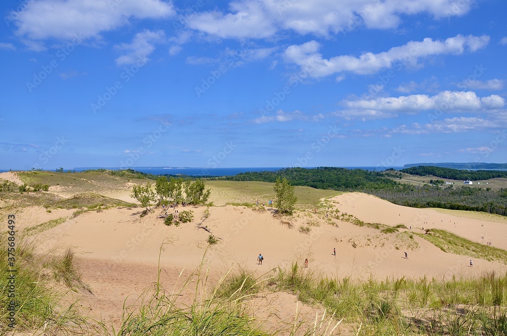Sleeping Bear Dunes National Lakeshore, located along the northwest coast of the Lower Peninsula of Michigan . Scenery of the dunes and lakeshore Sleeping Bear Dunes National Lakeshore, located along the northwest coast of the Lower Peninsula of Michigan . Scenery of the dunes and lakeshore