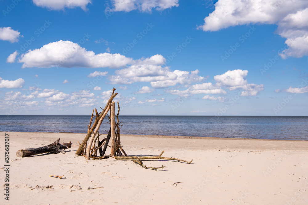 Sea coast with clouds in sunny summer day.