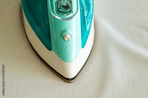 Stylish,steam iron on fabric,close up