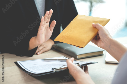 Фотография Government officials refusing money to take the bribe money from business man th