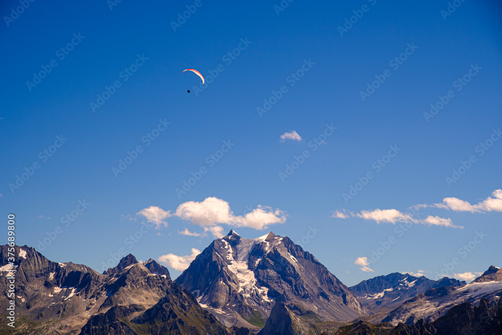 Paraglider over the mountains of French Alps