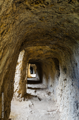 Tunnel hollowed out in a rock over the gorge of the Aniene river next to the Villa of Manlio Vopisco. Tivoli, Italy