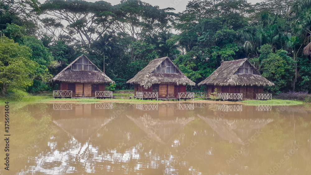 rustic houses next to a lake in tarapoto peru rustic houses next to a lake in tarapoto peru