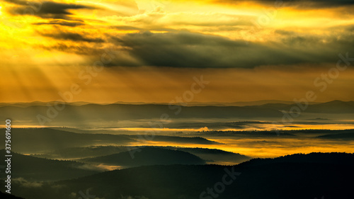 Sunrise over the mountain forest. Bieszczady National Park. Carpathian Mountains. Poland.